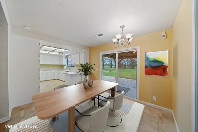a bathroom with a sink vanity and mirror