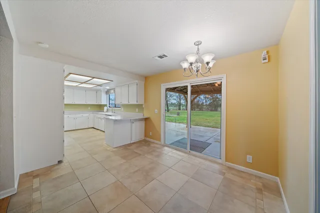a view of a hallway with a chandelier