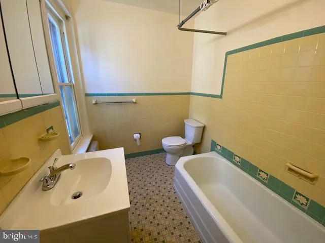 a bathroom with a sink and a tub