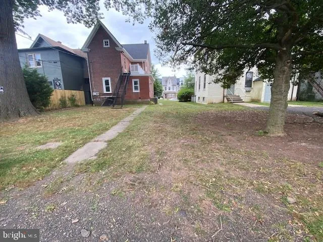 a view of large house with a yard