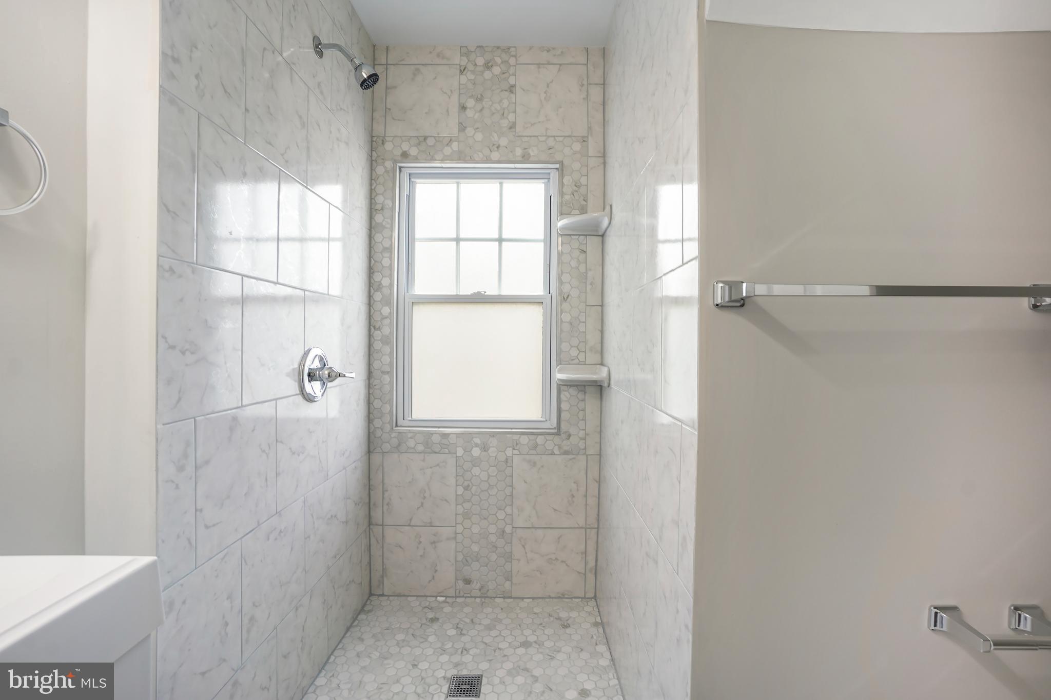 514 Silver Spring Avenue Silver Spring, MD 20910 - Photo 18 of 32 a bathroom with a shower