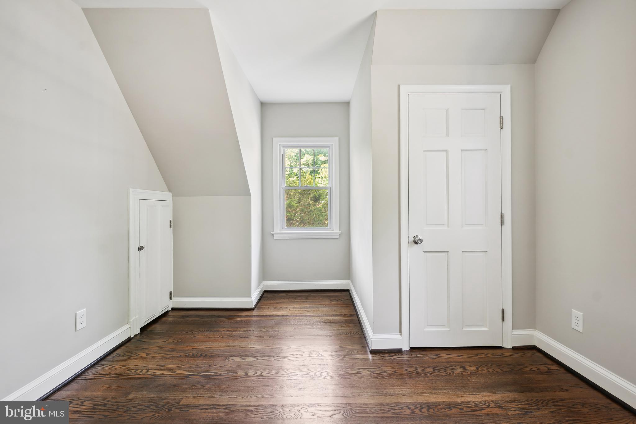 514 Silver Spring Avenue Silver Spring, MD 20910 - Photo 19 of 32 an empty room with wooden floor closet and windows