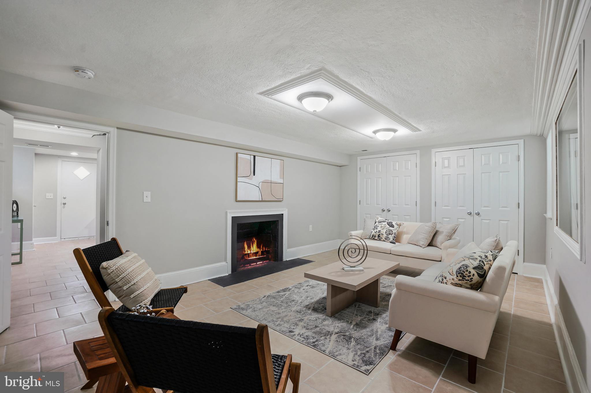 514 Silver Spring Avenue Silver Spring, MD 20910 - Photo 22 of 32 a living room with furniture and a fireplace