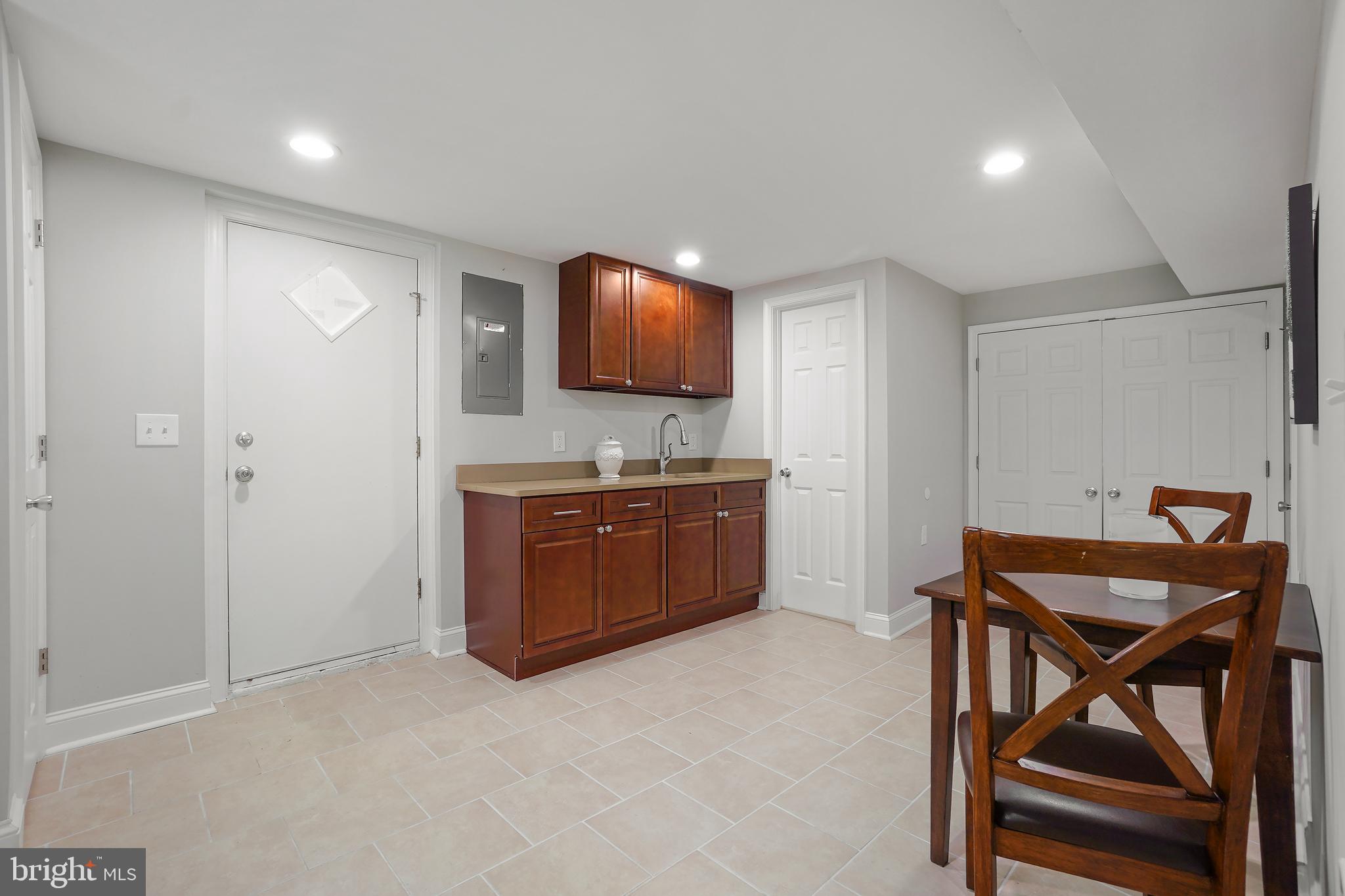 514 Silver Spring Avenue Silver Spring, MD 20910 - Photo 24 of 32 a room with a table and chairs