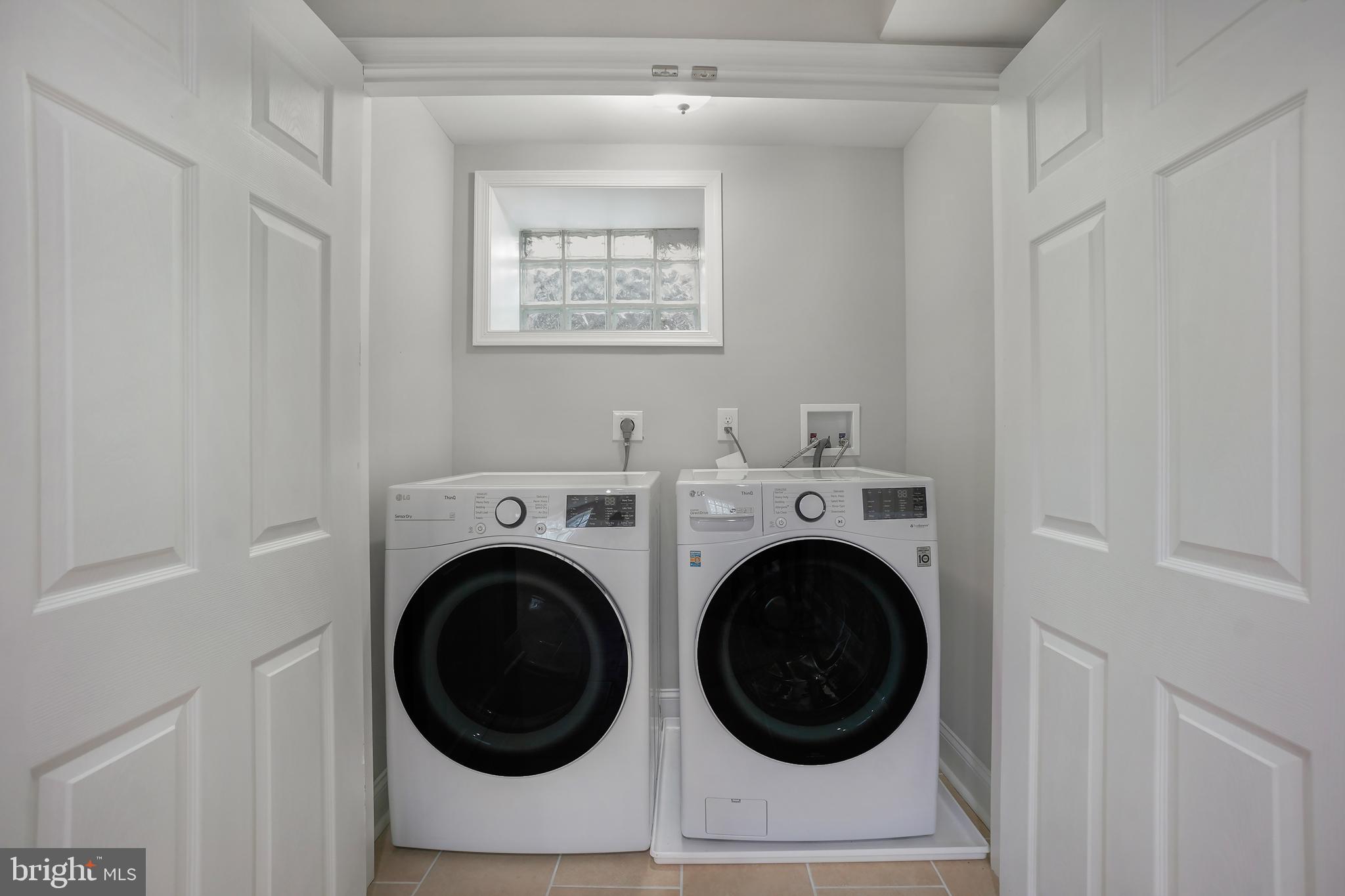 514 Silver Spring Avenue Silver Spring, MD 20910 - Photo 27 of 32 a utility room with dryer and washer