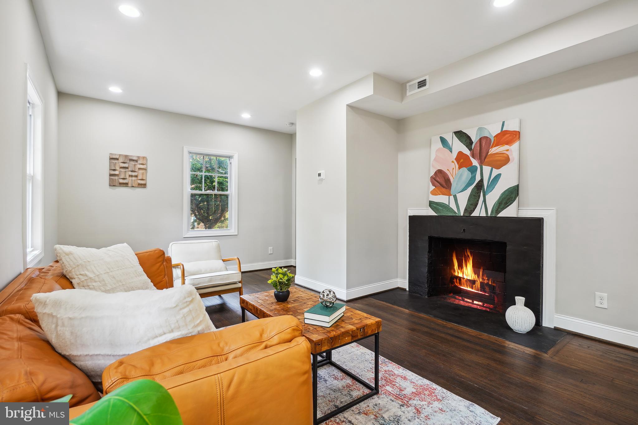 514 Silver Spring Avenue Silver Spring, MD 20910 - Photo 4 of 32 a living room with furniture and a fireplace