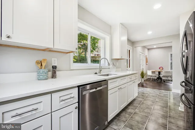 a kitchen with sink and cabinets