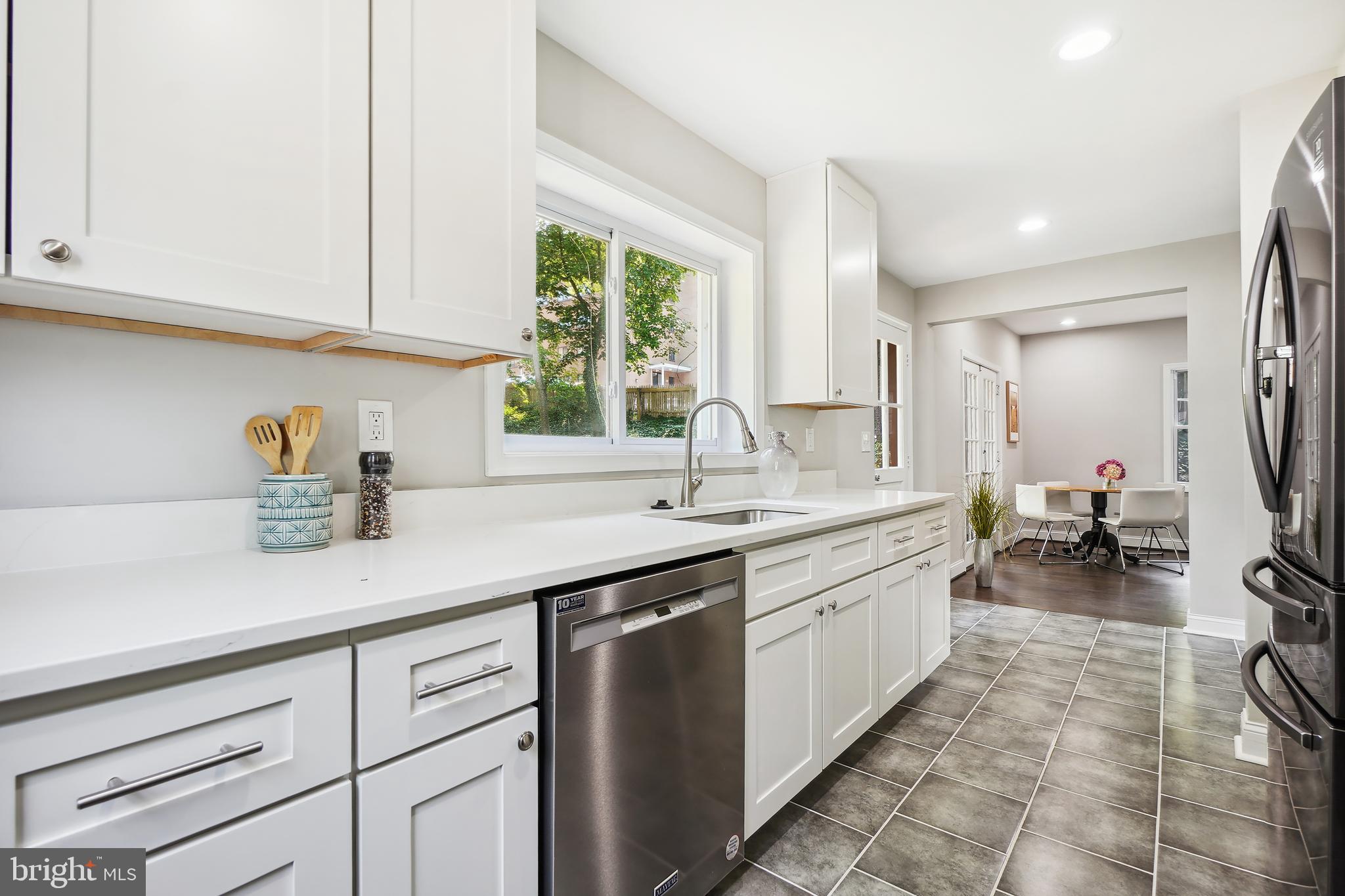 514 Silver Spring Avenue Silver Spring, MD 20910 - Photo 8 of 32 a kitchen with sink and cabinets