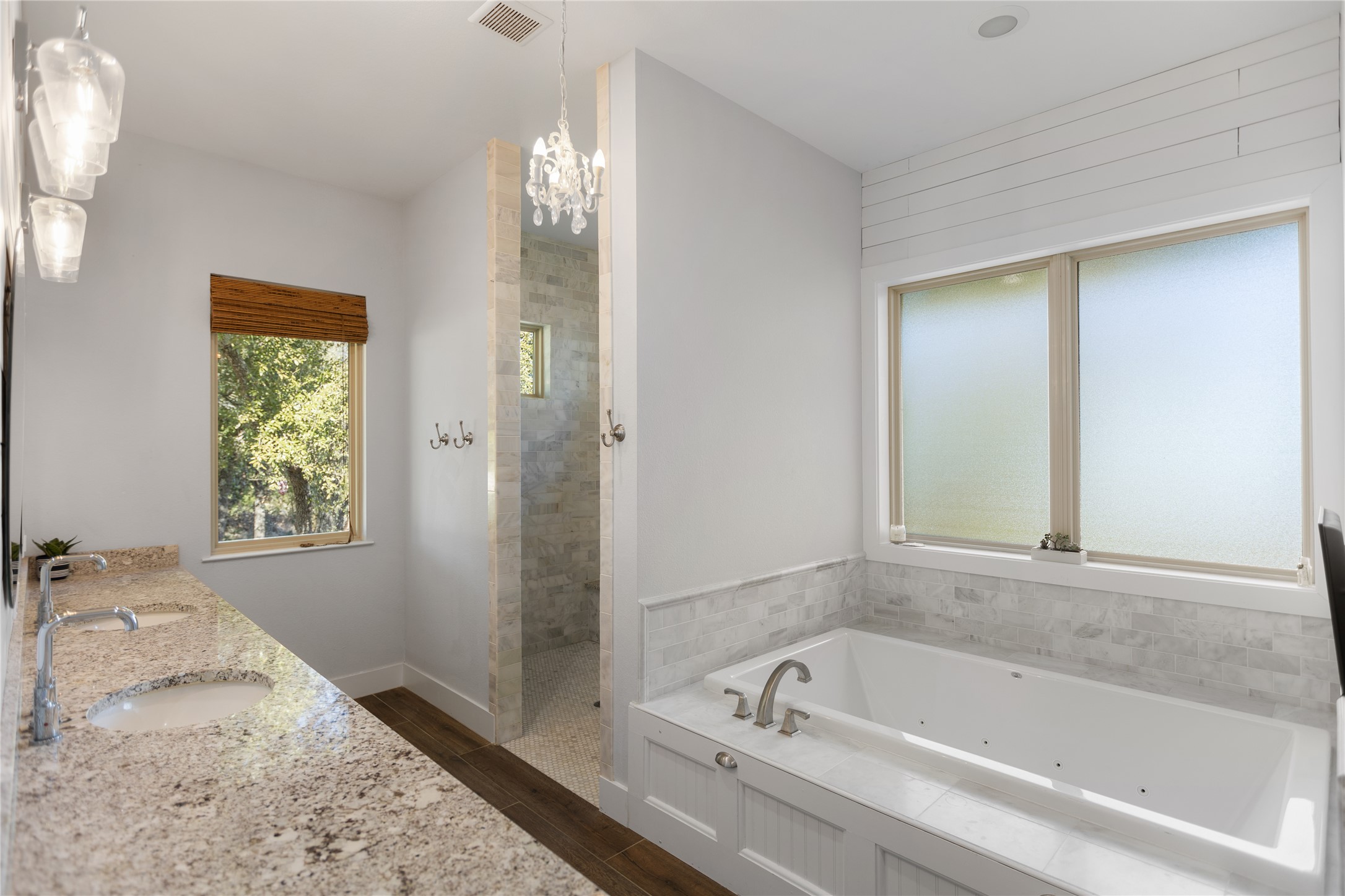 1821 Overland Stage Road Dripping Springs, TX 78620 - Photo 20 of 39 a bathroom with a tub and a window