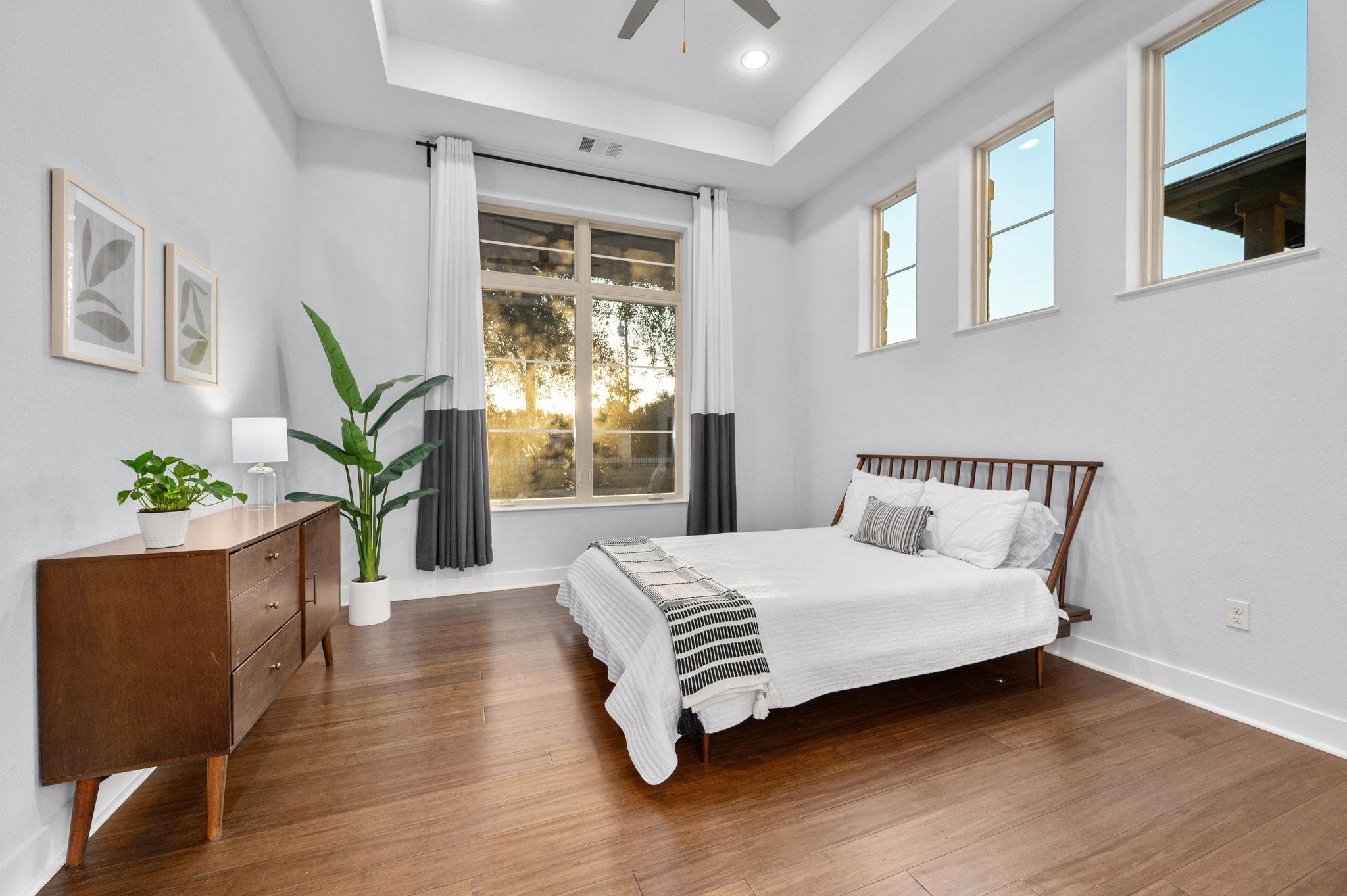 1821 Overland Stage Road Dripping Springs, TX 78620 - Photo 23 of 39 a bedroom with a bed lamp and a potted plant