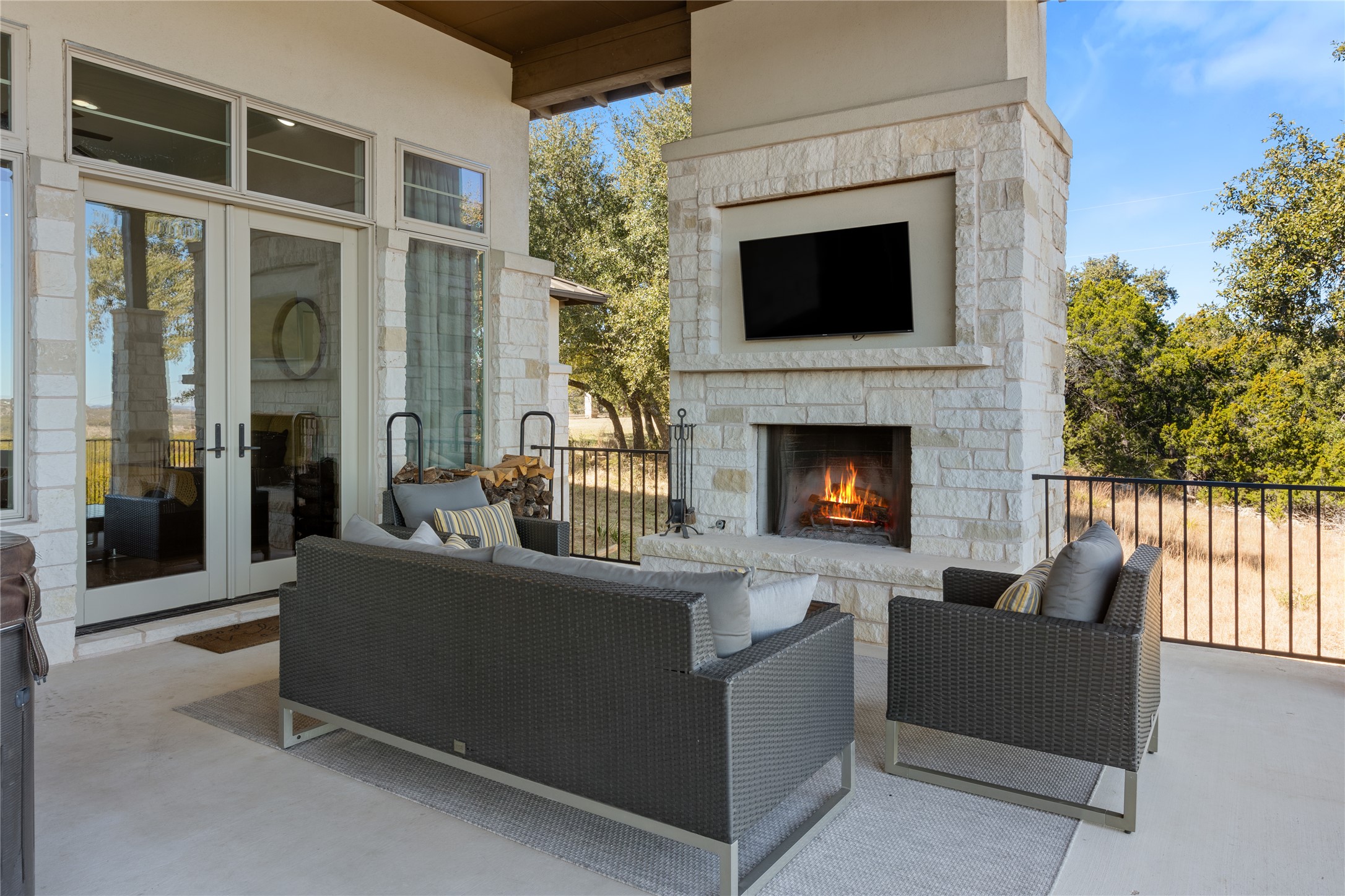1821 Overland Stage Road Dripping Springs, TX 78620 - Photo 36 of 39 a living room with furniture a flat screen tv and a fireplace