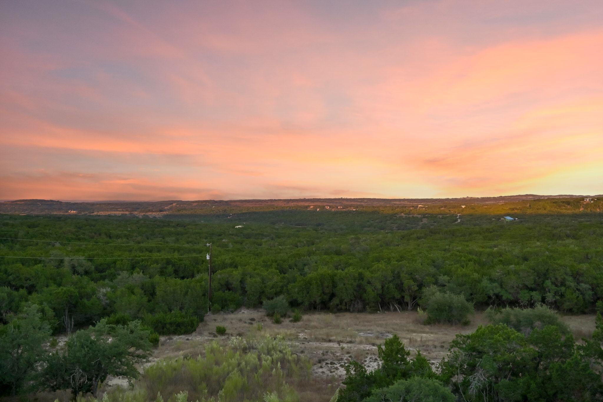 1821 Overland Stage Road Dripping Springs, TX 78620 - Photo 39 of 39 a view of a lush green outdoor space with a lake view and mountain view
