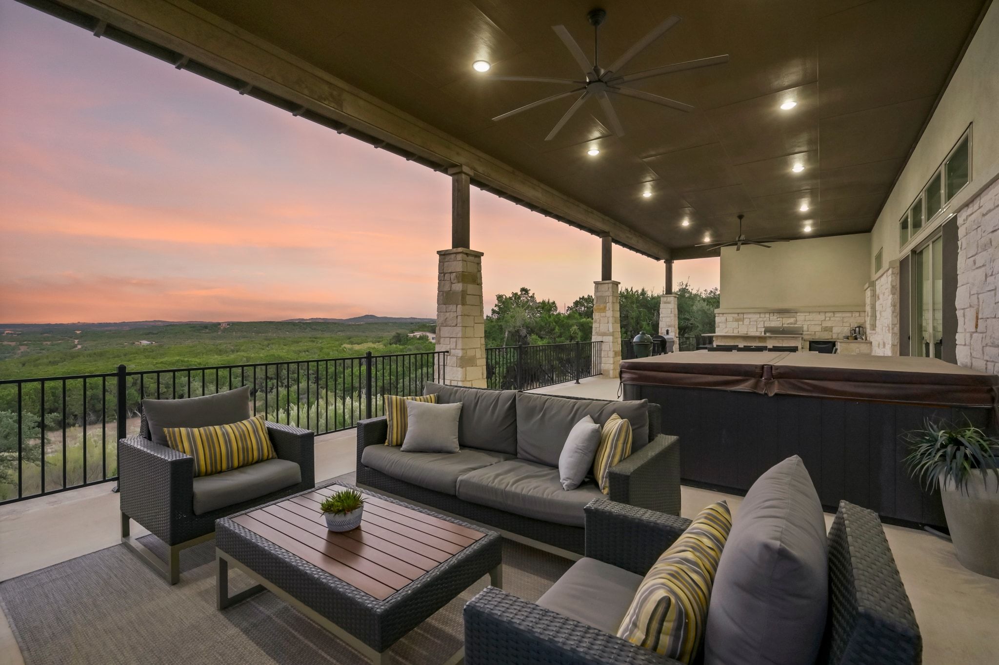 1821 Overland Stage Road Dripping Springs, TX 78620 - Photo 7 of 39 a roof deck with couches and potted plants with sky view