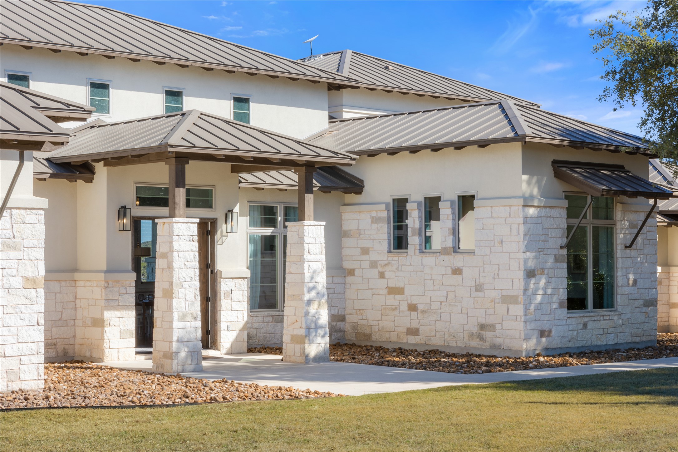 1821 Overland Stage Road Dripping Springs, TX 78620 - Photo 10 of 39 a front view of a house with a yard