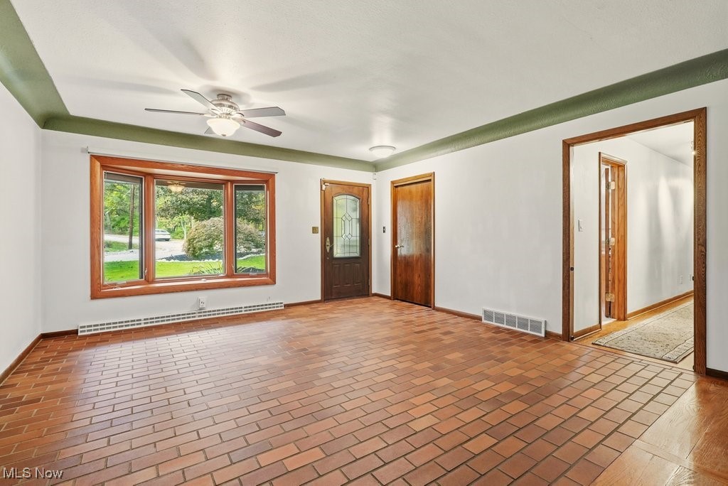 8304 Montello Road Independence, OH 44131 - Photo 5 of 45 Foyer entry and dining room