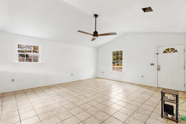 a kitchen with stainless steel appliances a stove a microwave a sink a counter top space and cabinets