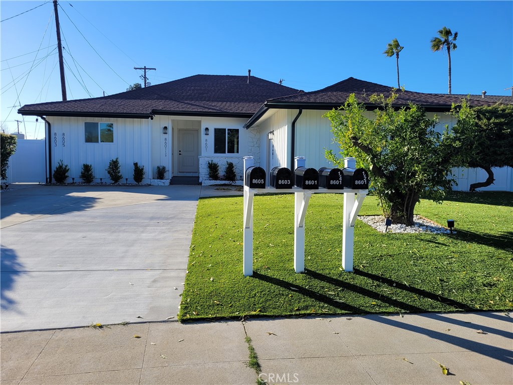 8601 Delco Avenue, Unit 1/4 Winnetka, CA 91306 - Photo 1 of 25 a view of a house with backyard sitting area and swimming pool