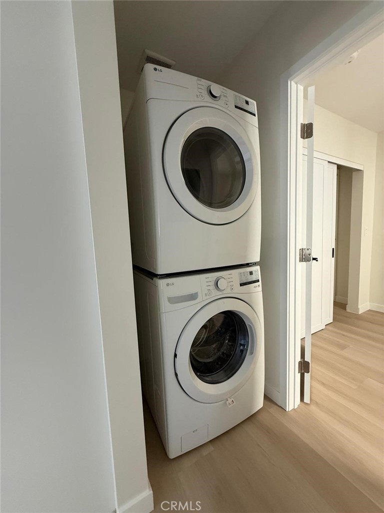 8601 Delco Avenue, Unit 1/4 Winnetka, CA 91306 - Photo 14 of 25 a utility room with dryer and washer