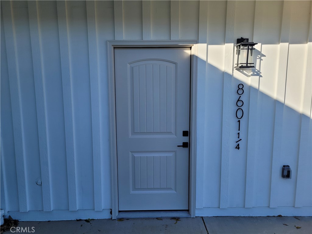 8601 Delco Avenue, Unit 1/4 Winnetka, CA 91306 - Photo 3 of 25 a kitchen with cabinets and wooden cabinets