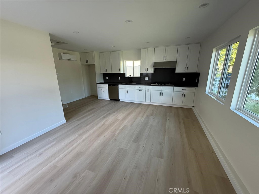 8601 Delco Avenue, Unit 1/4 Winnetka, CA 91306 - Photo 6 of 25 a view of kitchen with sink and wooden floor