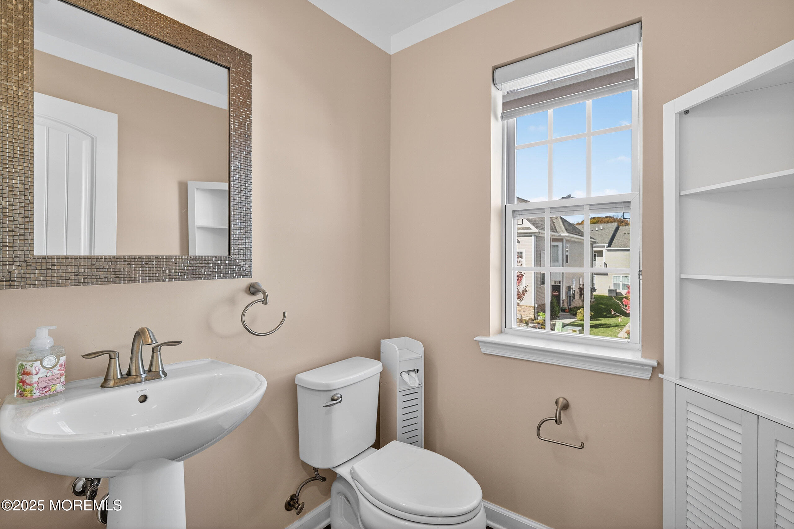67 Grabowski Drive, Unit 321 Parlin, NJ 08859 - Photo 11 of 38 a bathroom with a sink a toilet and mirror