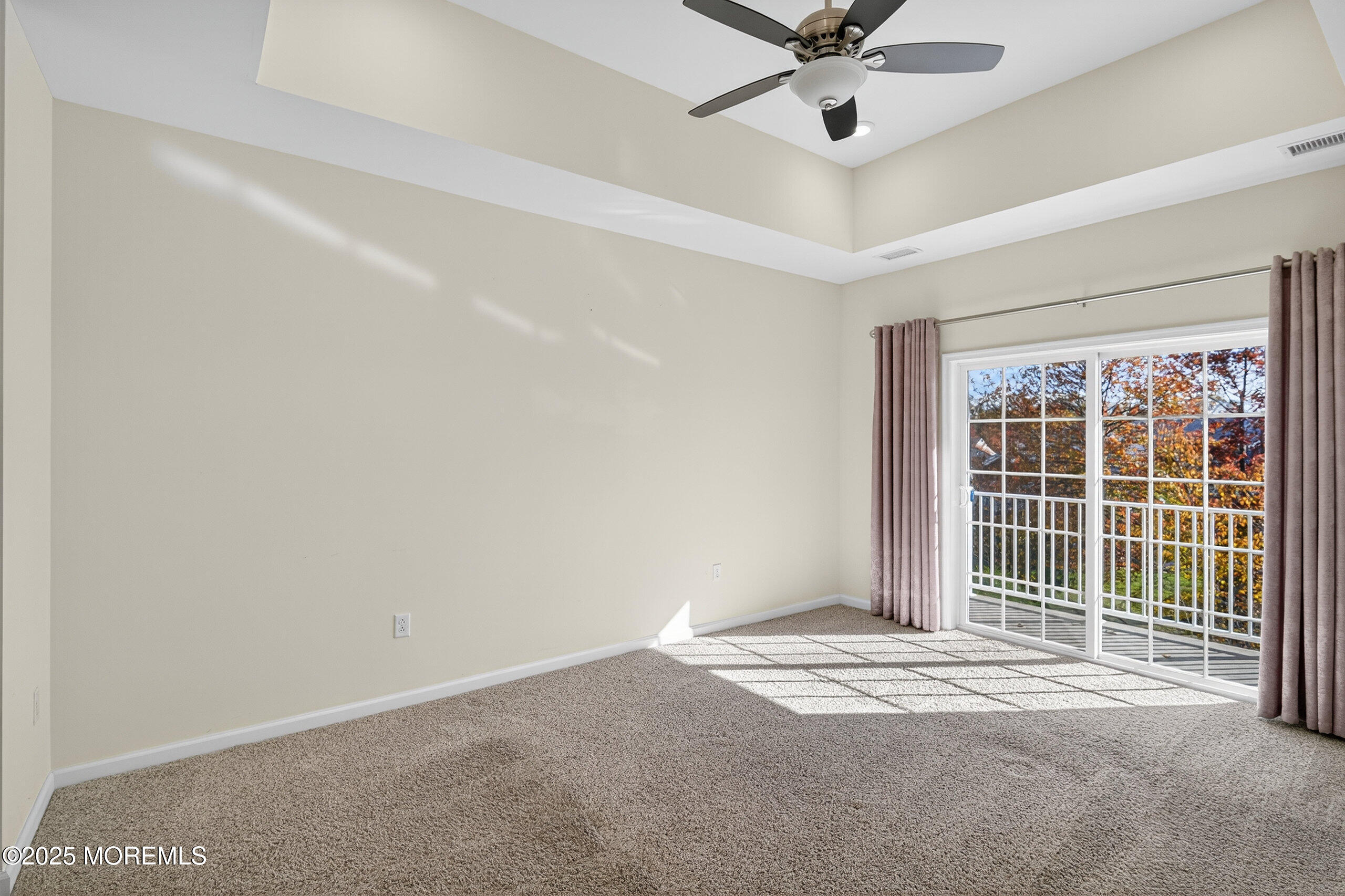 67 Grabowski Drive, Unit 321 Parlin, NJ 08859 - Photo 12 of 38 a view of a livingroom with a ceiling fan and window
