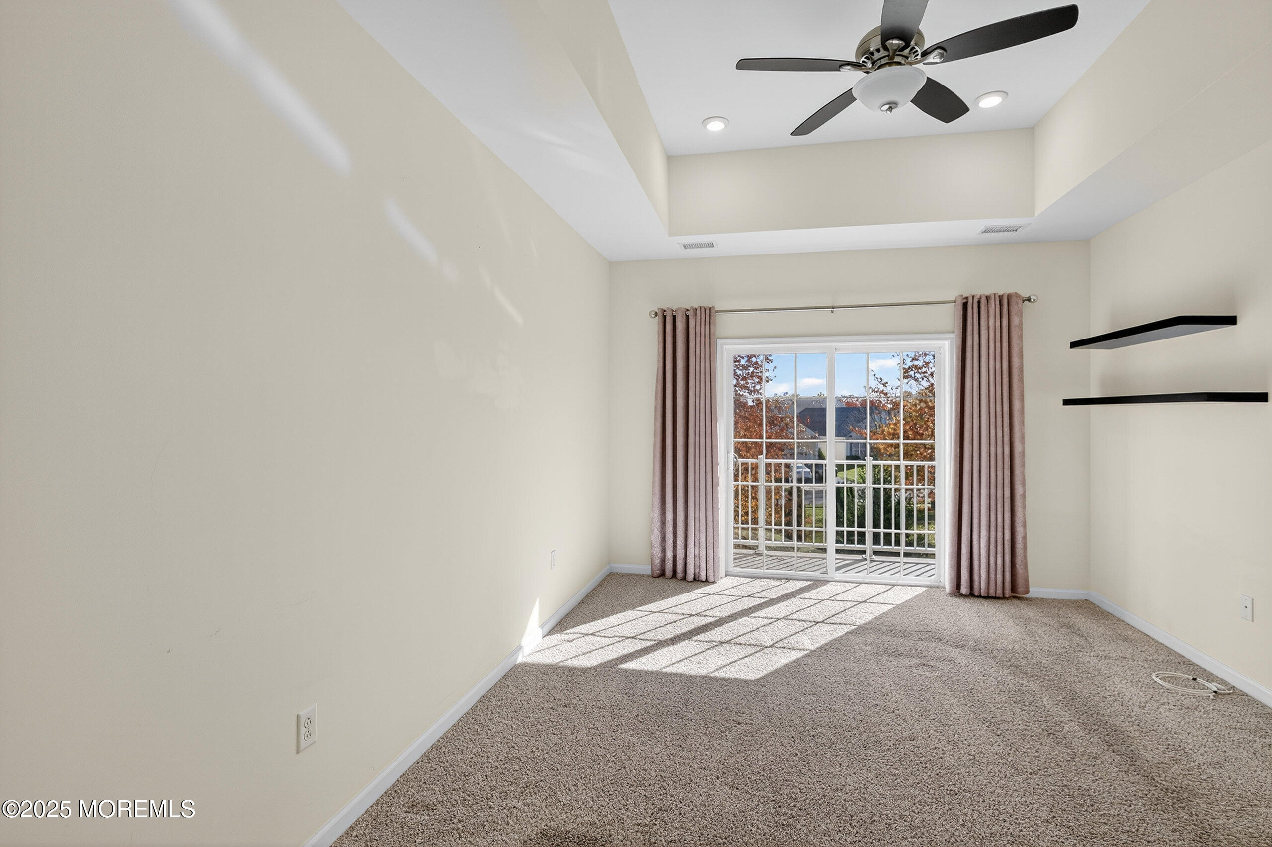 67 Grabowski Drive, Unit 321 Parlin, NJ 08859 - Photo 13 of 38 a view of empty room with wooden floor and fan