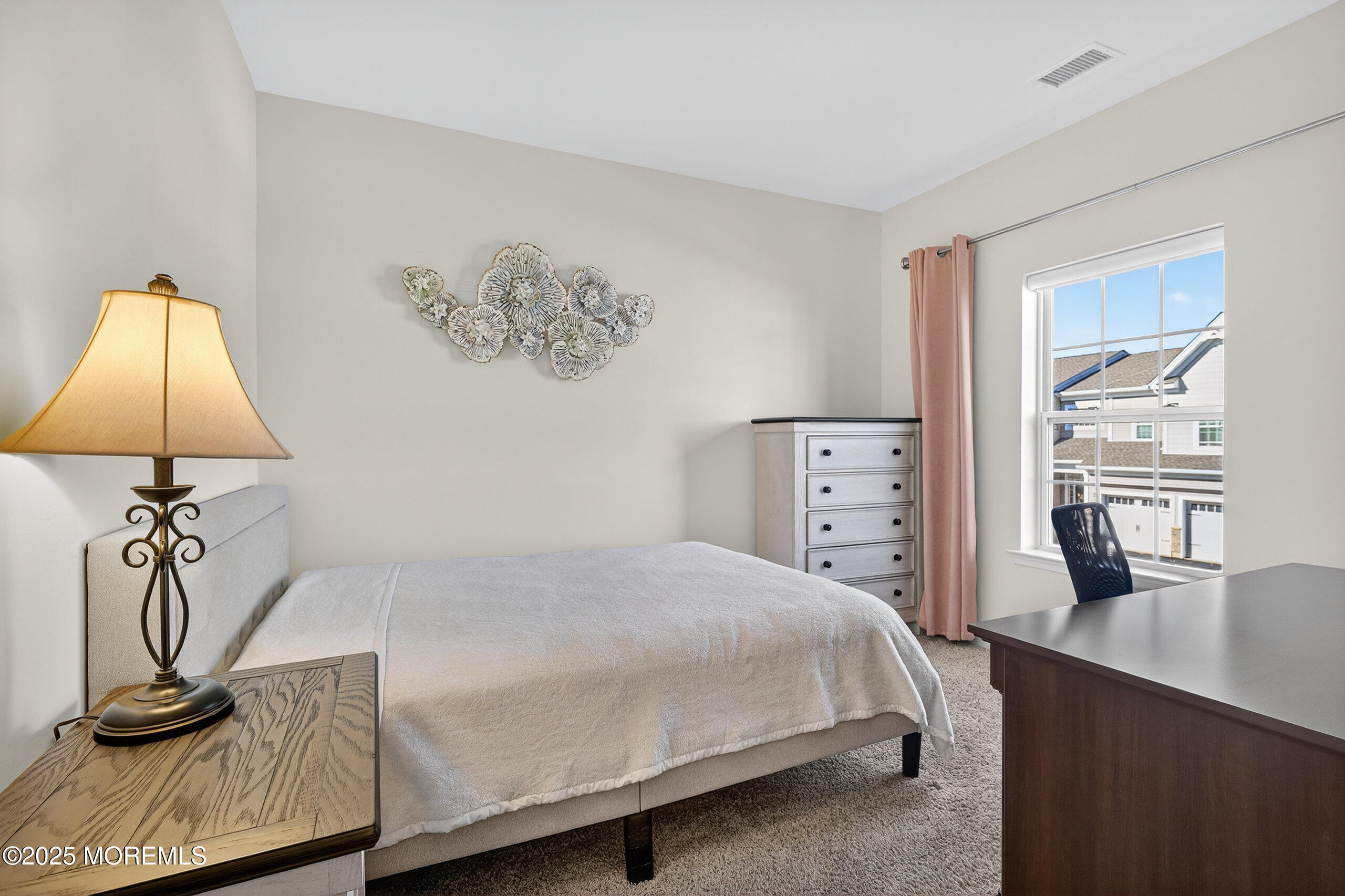 67 Grabowski Drive, Unit 321 Parlin, NJ 08859 - Photo 21 of 38 a bedroom with a bed and a flat screen tv