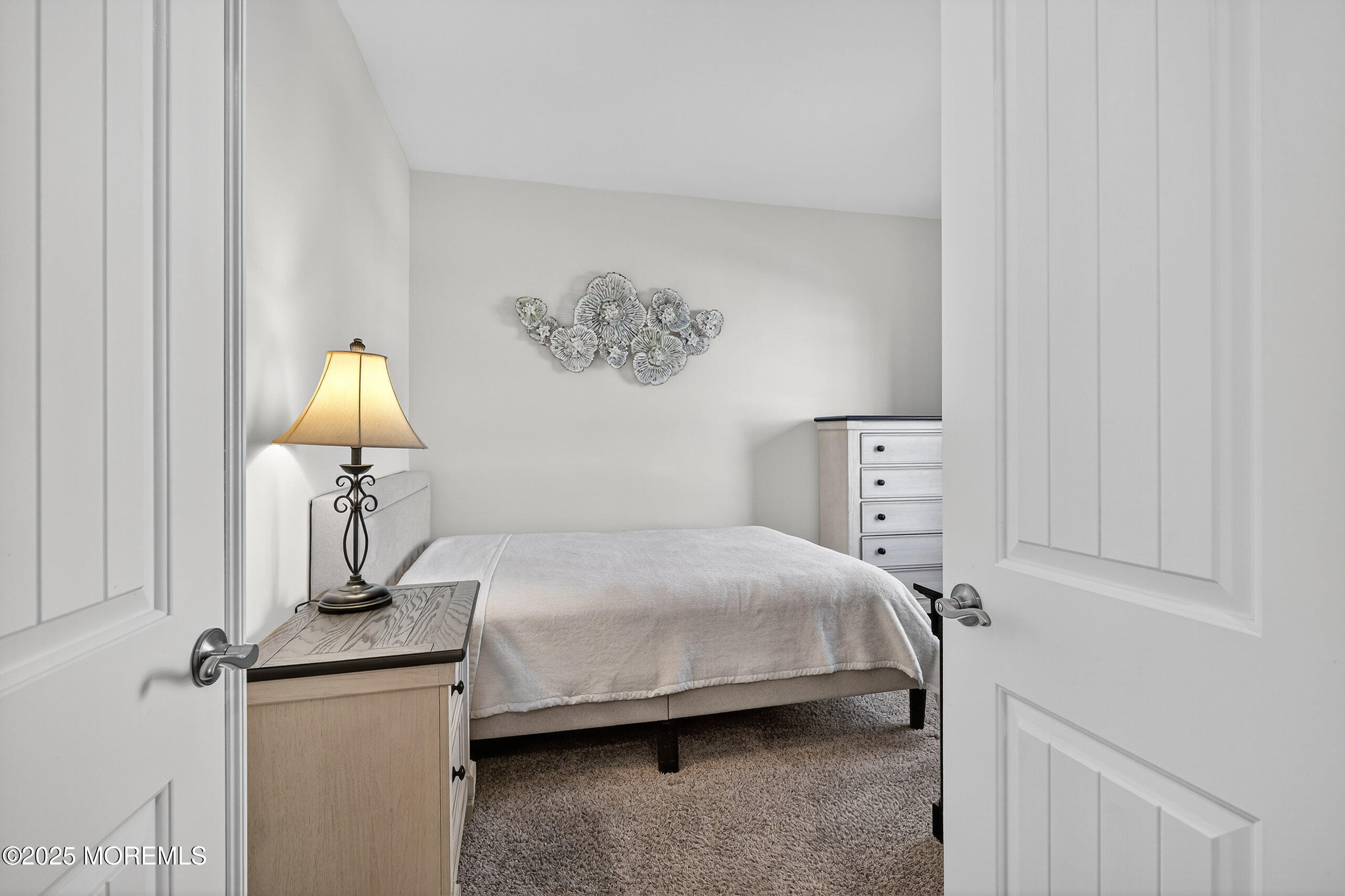 67 Grabowski Drive, Unit 321 Parlin, NJ 08859 - Photo 25 of 38 a bedroom with a bed and wooden floor