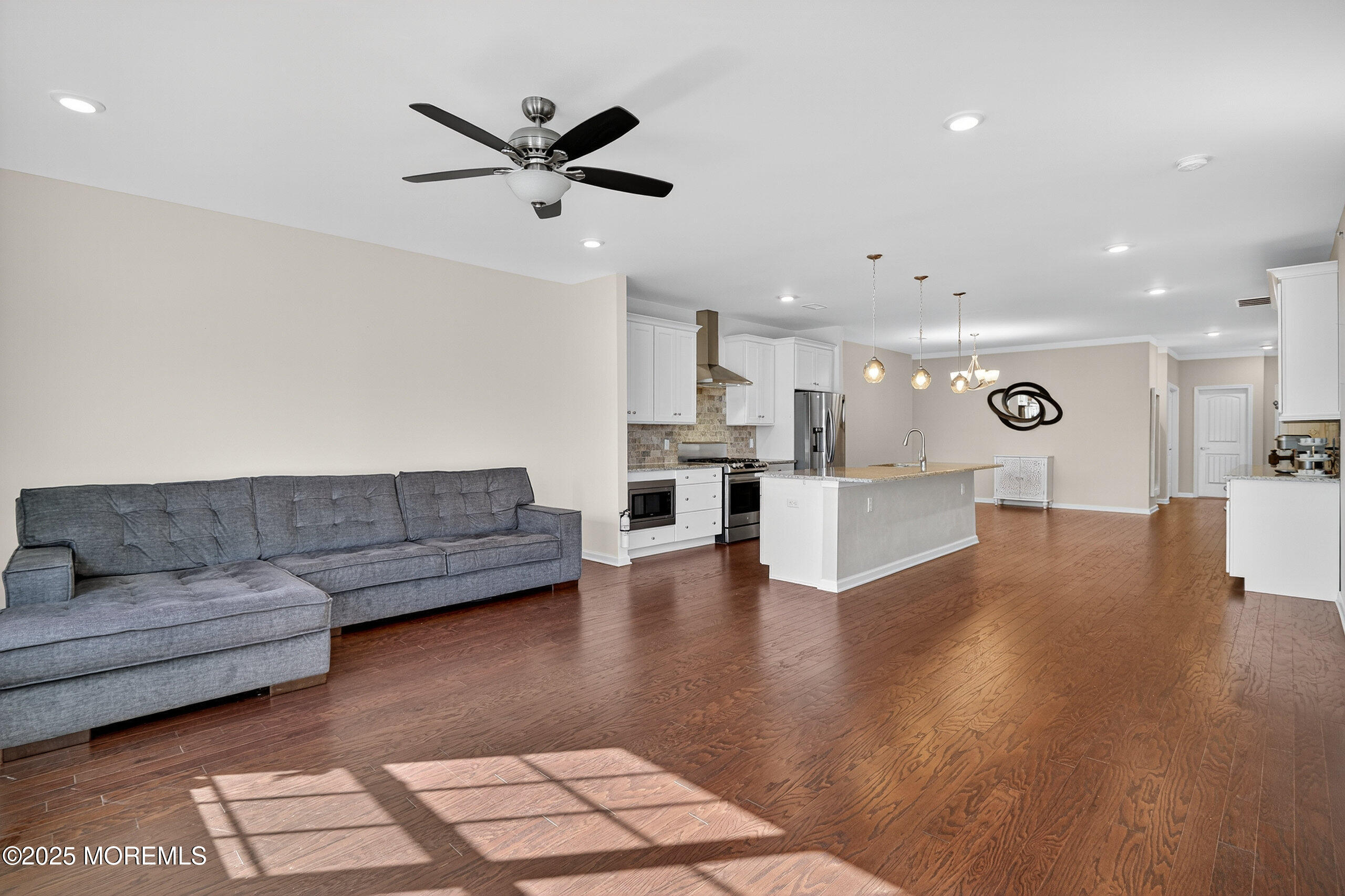 67 Grabowski Drive, Unit 321 Parlin, NJ 08859 - Photo 27 of 38 a living room with furniture and kitchen view