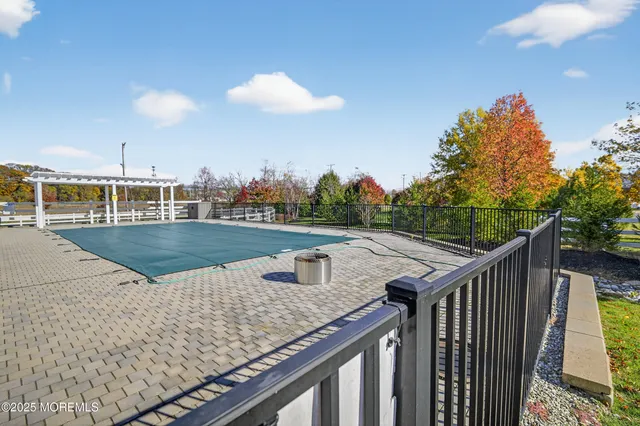 a view of a swimming pool with a patio