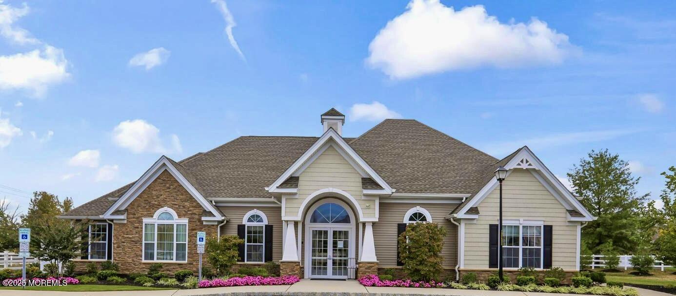 67 Grabowski Drive, Unit 321 Parlin, NJ 08859 - Photo 37 of 38 a view of a house with a yard and potted plants
