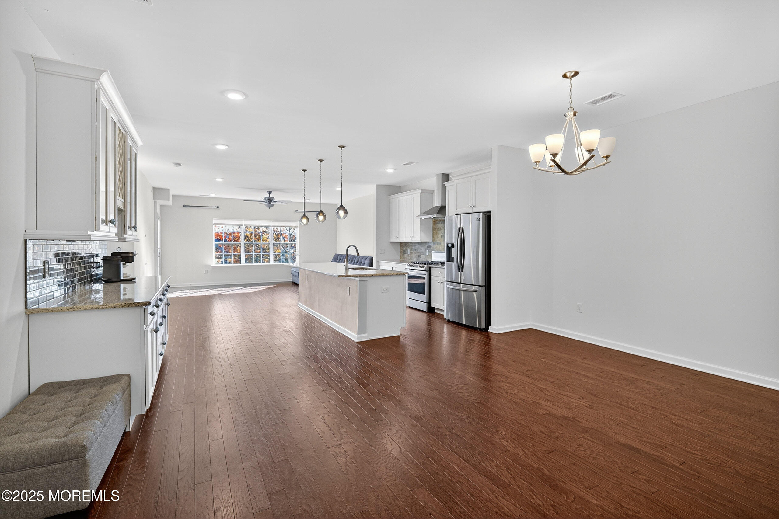 67 Grabowski Drive, Unit 321 Parlin, NJ 08859 - Photo 4 of 38 a view of large kitchen with wooden floor and stainless steel appliances