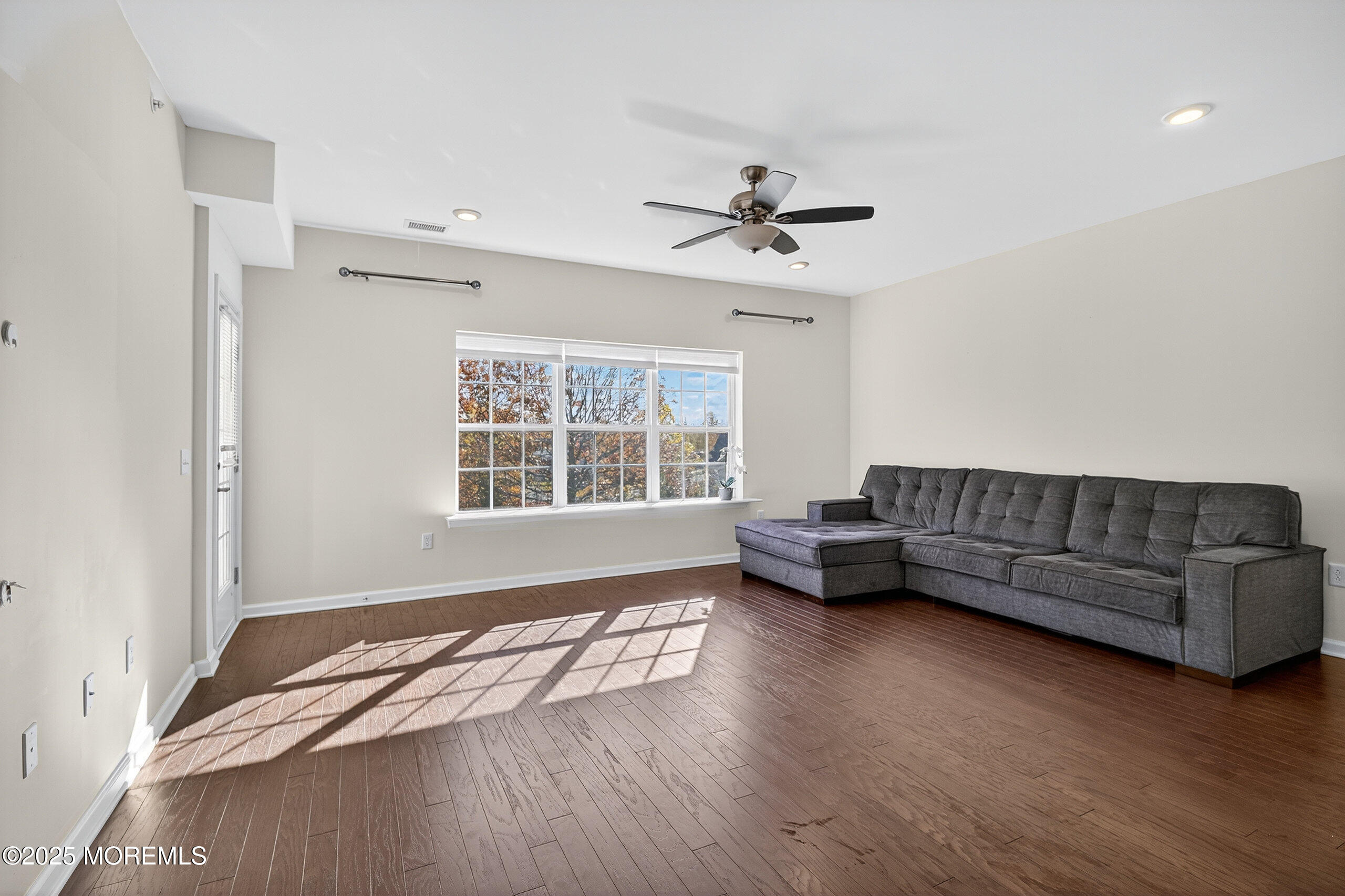 67 Grabowski Drive, Unit 321 Parlin, NJ 08859 - Photo 9 of 38 a living room with furniture and a window
