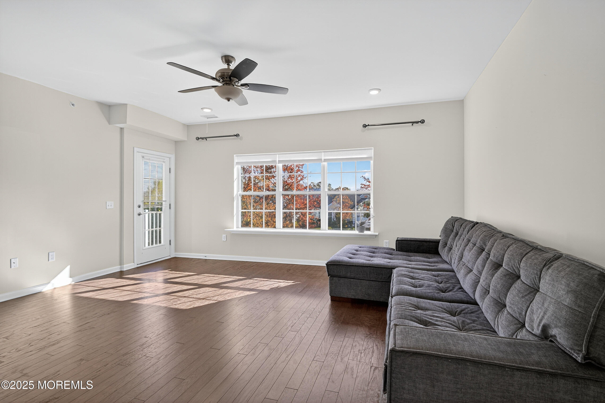 67 Grabowski Drive, Unit 321 Parlin, NJ 08859 - Photo 10 of 38 a living room with furniture and a large window
