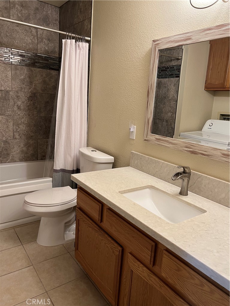 11675 Maple Street Apple Valley, CA 92308 - Photo 6 of 7 a bathroom with a sink and a mirror
