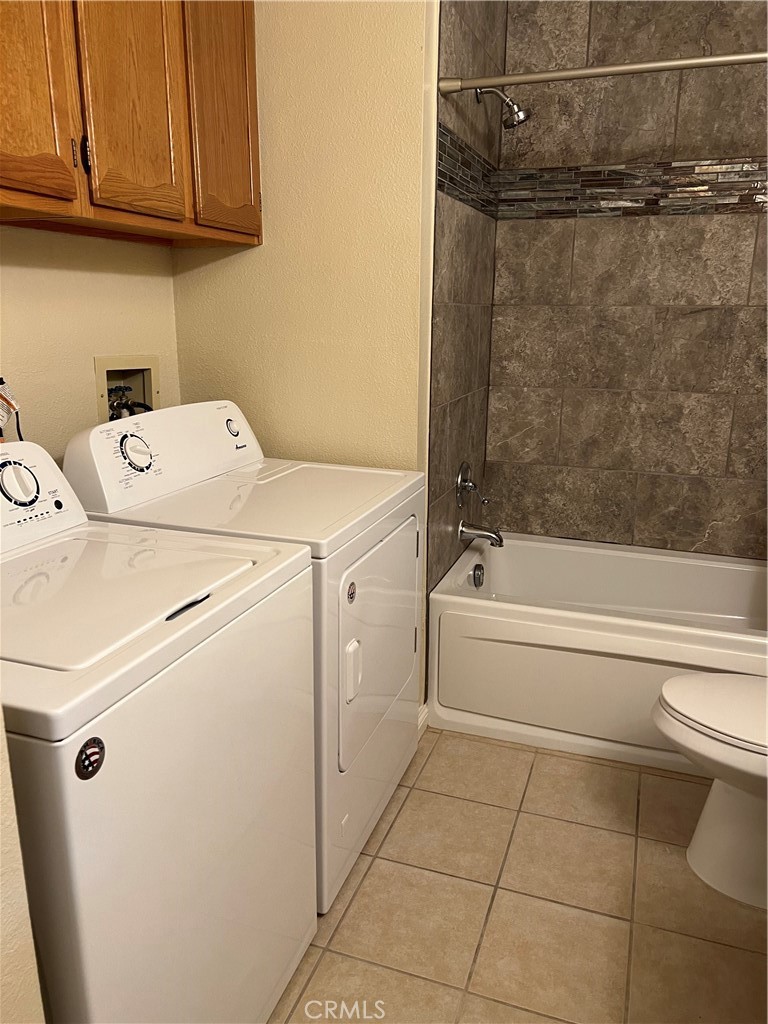11675 Maple Street Apple Valley, CA 92308 - Photo 7 of 7 a bathroom with a bathtub and a shower