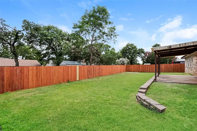 a view of a backyard with a slide