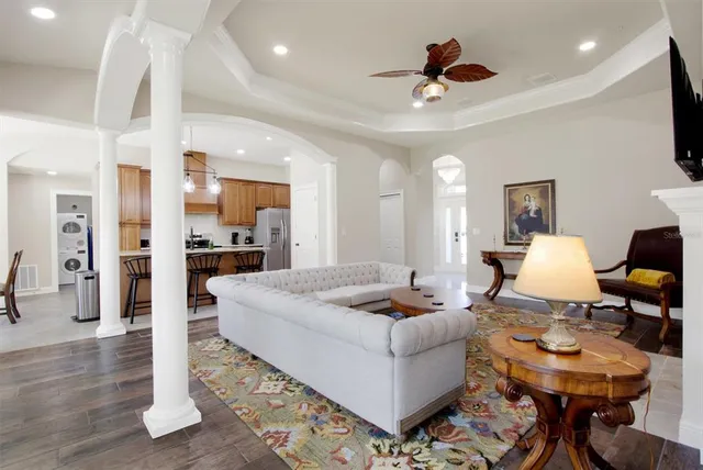 a living room with kitchen furniture and a kitchen view