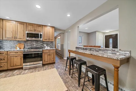 a kitchen with a stove and a microwave