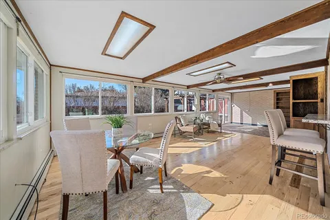 a view of a dining room with furniture window and outside view