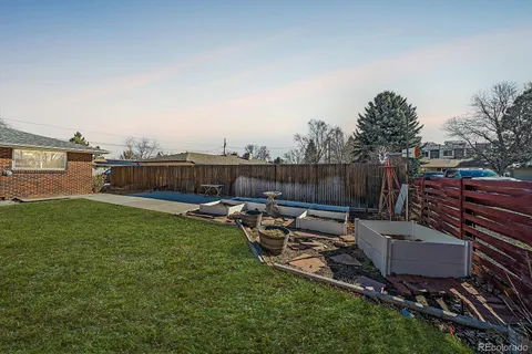 a view of a backyard with sitting area
