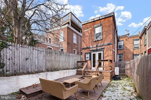 a view of a patio with a table and chairs