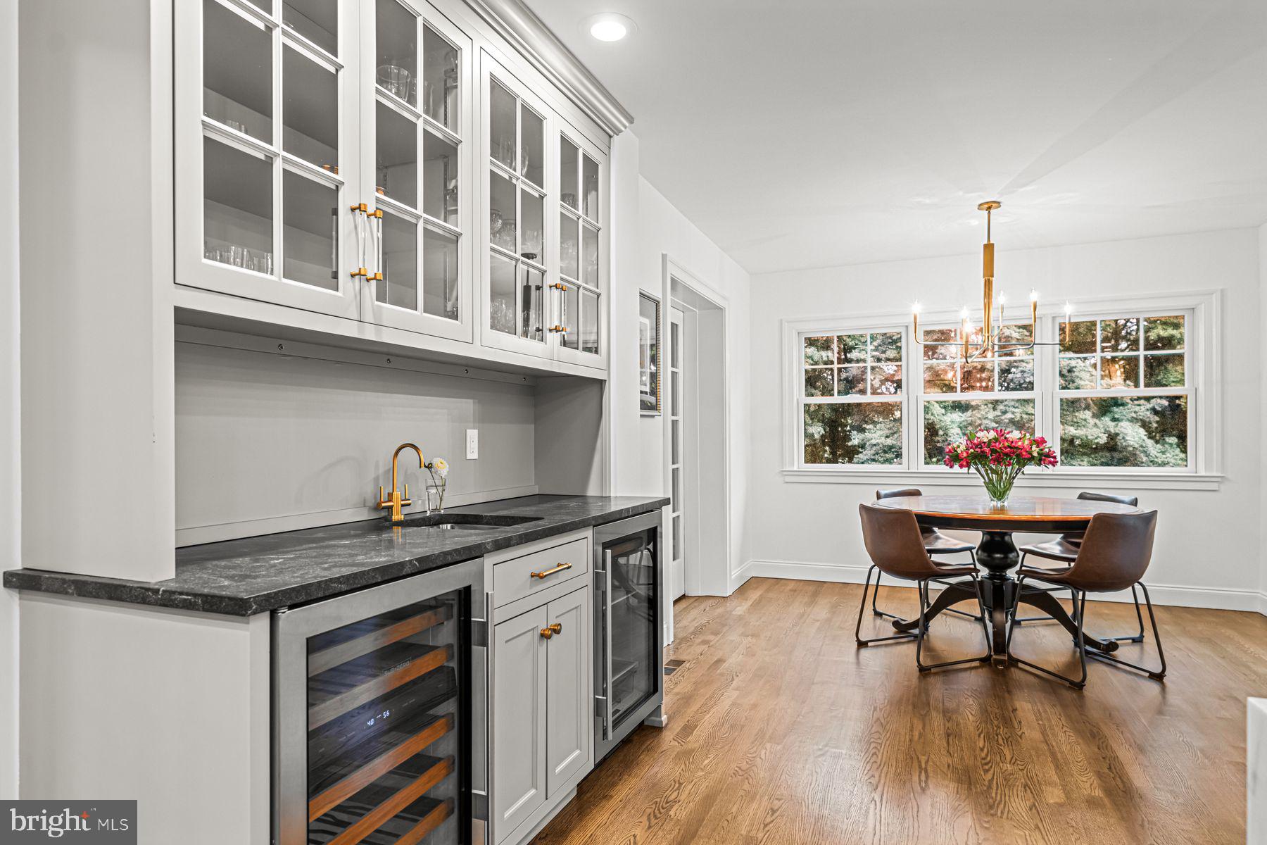 322 Edgehill Road Wayne, PA 19087 - Photo 17 of 42 a kitchen with a table chairs and wooden floor