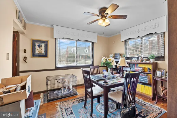 a living room with lots of furniture and wooden floor