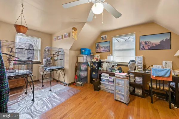 a living room with furniture rug and wooden floor