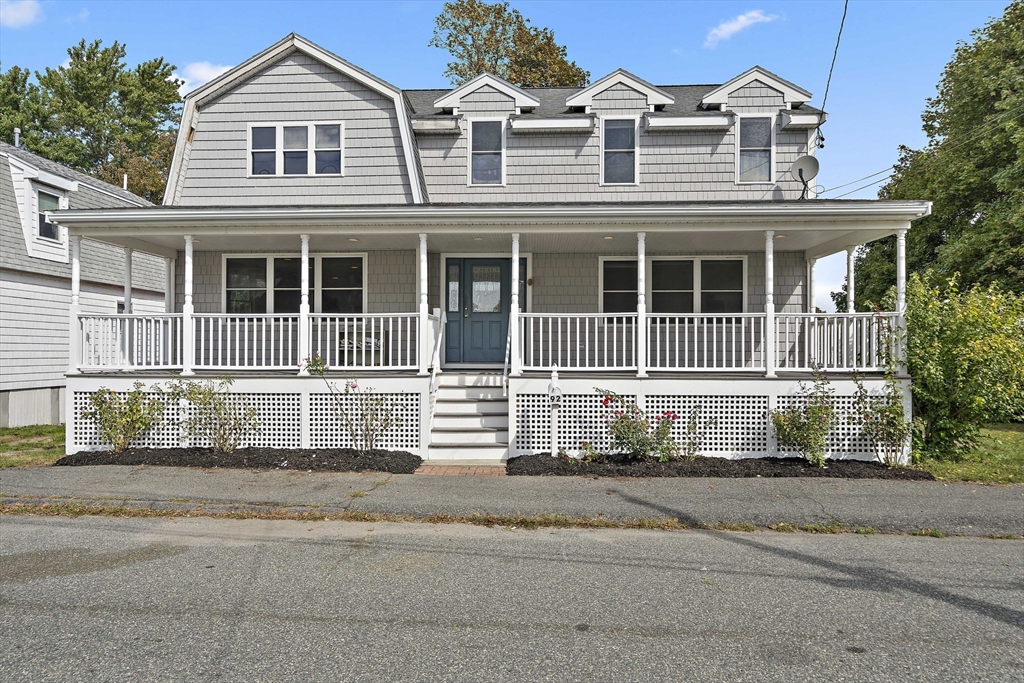 92 Spring Street Quincy, MA 02169 - Photo 1 of 34 a front view of a house with a yard