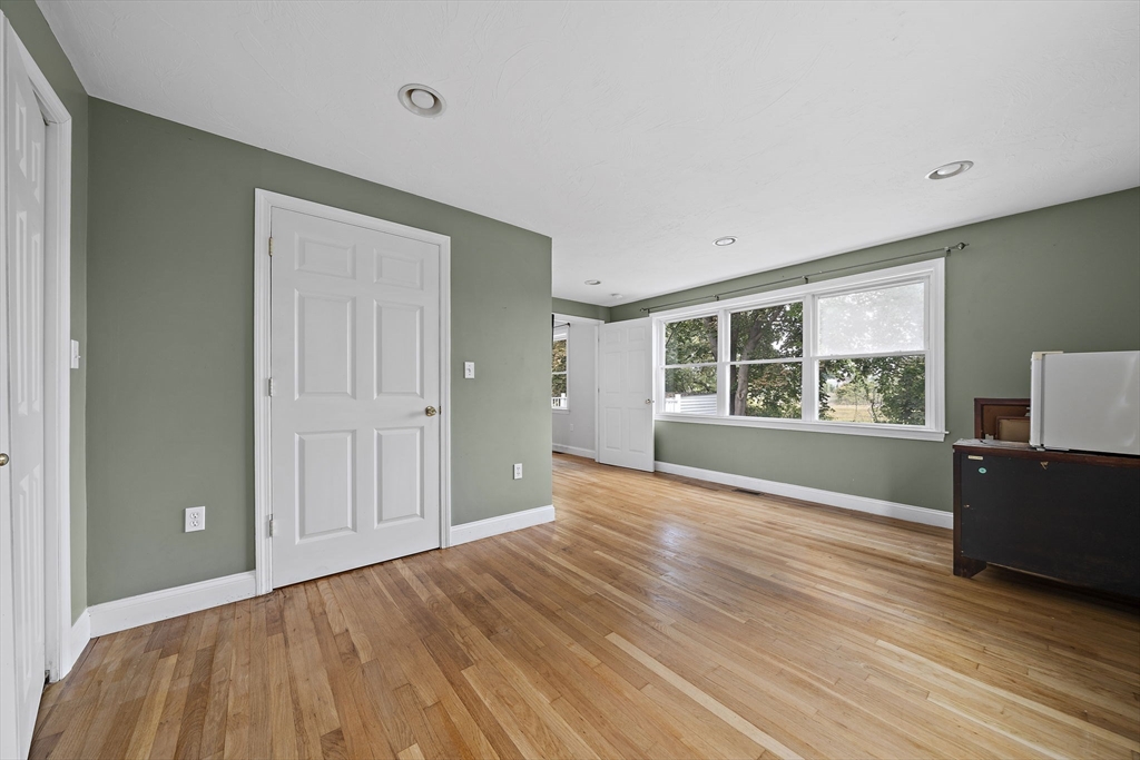 92 Spring Street Quincy, MA 02169 - Photo 13 of 34 a view of empty room with wooden floor and window