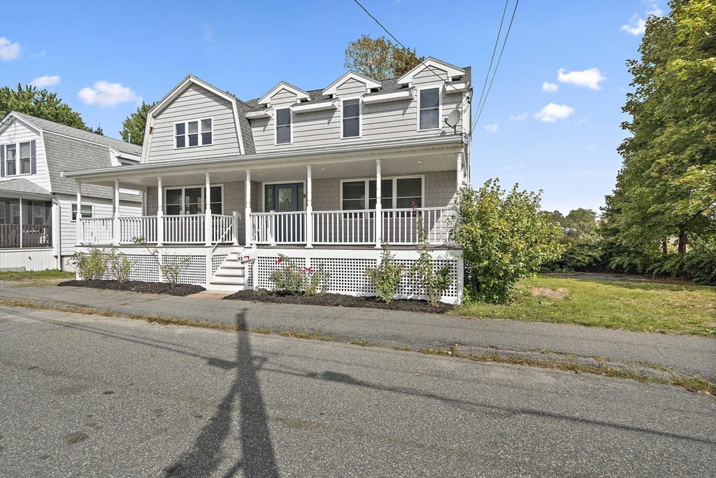 92 Spring Street Quincy, MA 02169 - Photo 2 of 34 front view of a house with a yard