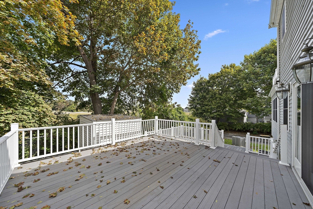 92 Spring Street Quincy, MA 02169 - Photo 23 of 34 a view of a deck with two chair and wooden floor